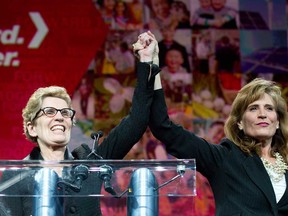 Runner-up Sandra Pupatello, right, celebrates Kathleen Wynne's victory and making her the first women Premier at the Ontario Liberal Leadership convention in Toronto on Saturday, January 26, 2013. (THE CANADIAN PRESS/Nathan Denette)