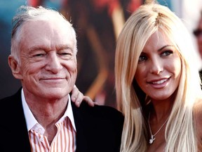 Hugh Hefner, left, and Crystal Harris arrive at the premiere of Iron Man 2 at the El Capitan Theatre in Los Angeles, April 26, 2010. Hefner is celebrating the new year as a married man once again.The 86-year-old Playboy magazine founder exchanged vows with his "runaway bride," Harris, at a private Playboy Mansion ceremony on New Year's Eve, Dec. 31, 2012. (THE CANADIAN PRESS/AP/Matt Sayles)