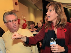 Sandra Pupatello speaks with Ken Lewenza, president of the Canadian Auto Workers union Thursday, Nov. 8, 2012, in Windsor, Ont. Pupatello announced her candidacy for the Ontario Liberal leadership race. (DAN JANISSE/The Windsor Star)