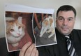 Flavio Zuccato displays photos of his cat Rocky on Thursday, Jan. 31, 2013, that went missing in August 2012 in Windsor, Ont. He is hoping the pet can be recovered. (DAN JANISSE/The Windsor Star)