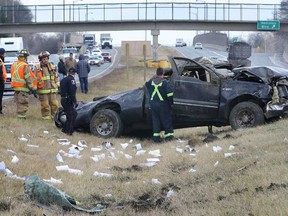 A man escaped serious injury Monday, Jan. 14, 2013, after rolling his pickup several times in the median of E.C. Row expressway. The accident occurred at approximately 11 a.m. in the eastbound lanes just west of Dominion Boulevard. Emergency personnel investigate the scene. (DAN JANISSE/The Windsor Star)