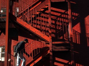 In this file photo, shadows are cast on a building as a student walks up stairs behind an apartment building on University Avenue West near the University of Windsor  in Windsor, Ont.  (JASON KRYK/ The Windsor Star)