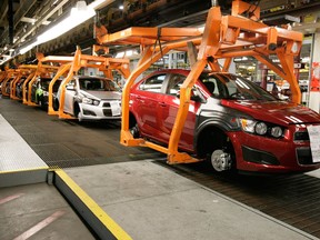 In this April 25, 2012 photo, Chevrolet Sonics move down the line at the General Motors Assembly plant in Orion Township, Mich. (Associated Press files)