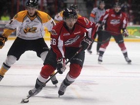 Windsor's Josh Ho-Sang, centre, races the puck up the ice in Windsor's 5-4 victory against the visiting Sarnia Sting at the WFCU Centre, Sunday, January 20, 2013.  (DAX MELMER / The Windsor Star)