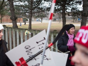 Despite imposed contracts and losing the right to strike, teachers' unions might continue their political protests. THE CANADIAN PRESS/Chris Young