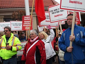 Mario Spagnuolo, not shown, first vice-president of the Greater Essex Elementary Teachers' Federation of Ontario, speaks with education workers as they hold a protest outside the Caboto Club where the Liberal's delegate election meeting was being held, Sunday, January 13, 2013.  (DAX MELMER / The Windsor Star)