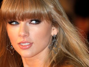This Jan. 26, 2013 file photo shows American singer-songwriter Taylor Swift at the Cannes festival palace, to take part in the NRJ Music awards ceremony in Cannes, southeastern France. Swift says you can expect some of her bolder choices of late, from her music to her new, sexier image, to be incorporated in her upcoming tour. Swift kicks off her worldwide tour in Omaha, Neb., next month in support of her latest album, “Red.” (AP Photo/Lionel Cironneau, file)