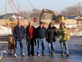 Grosvenor Drive residents Brian Hopson, left, Linda Hopson,  Tom Robert, Diane Pastorius and Andrea Barrette near the Rt. Hon. Herb Gray Parkway in LaSalle, Ontario on January 9, 2013. (JASON KRYK/ The Windsor Star)