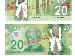 The front and back of the new Canadian $20 bill is shown in a handout photo. Thousands of vending machines still can't digest those plastic $20 bank notes the government released two months ago, with machine owners blaming the Bank of Canada for their problems. (THE CANADIAN PRESS/HO-Bank of Canada)