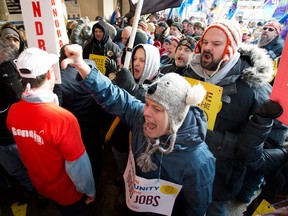 Ontario Liberal Party leadership convention delegates are greeted by hundreds of protesters as they arrive at convention in Toronto on Saturday January 26, 2013. THE CANADIAN PRESS/Frank Gunn