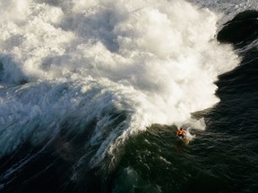 Tyler Fox competes during heat one of the Mavericks Invitational surf competition on January 20, 2013 in Half Moon Bay, California. (Photo by Ezra Shaw/Getty Images)