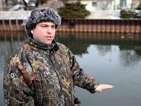 Mike Brewster, 35, is alarmed at the low water level of Little River in east Windsor, Sunday, January 27, 2013.  Water levels are at all-time low in some areas.  (DAX MELMER/The Windsor Star)