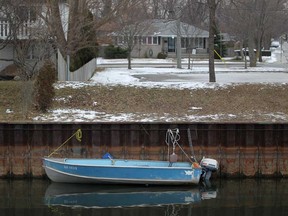 In this file photo, a fishing boat sits docked on the Little River in East Windsor, Sunday, January 27, 2013.  Water levels were at all-time low in some areas.  (DAX MELMER/The Windsor Star)