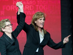 Sandra Pupatello (R) congratulates Kathleen Wynne following Wynne's victory of the Ontario Liberal Party leadership. Photographed Jan. 26, 2013. (Frank Gunn / Canadian Press)