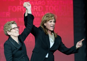 Sandra Pupatello (R) congratulates Kathleen Wynne following Wynne's victory of the Ontario Liberal Party leadership. Photographed Jan. 26, 2013. (Frank Gunn / Canadian Press)