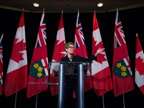 Kathleen Wynne laughs at her first press conference as new leader of the Ontario Liberal Party and soon-to-be Premier of Ontario. (Nathan Denette / Canadian Press)