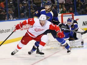 Carlo Colaiacovo, right, checks Daniel Cleary in a game between St. Louis and Detroit last year. Colaiacovo is now a member of the Red Wings. (Photo by Dilip Vishwanat/Getty Images)