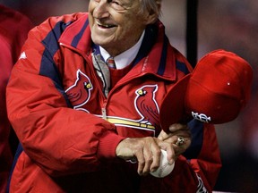 Hall of Famer Stan Musial throws out the ceremonial first pitch before Game 5 of the World Series between the St. Louis Cardinals and Detroit Tigers in St. Louis. (AP Photo/Elise Amendola)