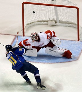 Blues rookie Vladimir Tarasenko scores a goal on Detroit goalie Jimmy Howard Saturday in St. Louis. (AP Photo/Jeff Roberson)