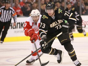 Dallas forward Michael Ryder, right, is checked by Detroit's Pavel Datsyuk. (Photo by Ronald Martinez/Getty Images)