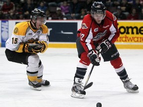 Windsor's Alex Aleardi, right, is checked by Sarnia's Davis Brown at the WFCU Centre. (DAX MELMER/The Windsor Star)