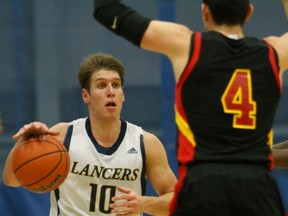 Lancer Michael Petrella, left, is guarded by Guelph's Daniel McCarthy at the St. Denis Centre. (JASON PRUPAS/ Special to the Star)