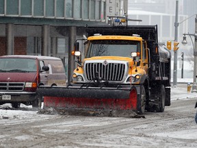 City of Windsor snow plow and salter heads south on Ferry Street from Riverside Drive West. (Windsor Star files)