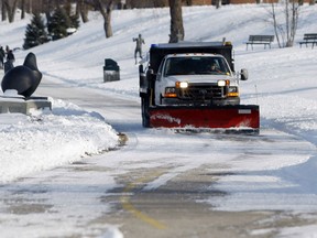 A City of Windsor snow plow is driven along Windsor's waterfront during snow removal following recent days of heavy snow. (Windsor Star files)