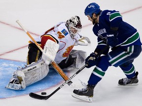 LaSalle's Zack Kassian, right, scores the winning goal against Calgary Flames goalie Miikka Kiprusoff Wednesday in Vancouver. (THE CANADIAN PRESS/Darryl Dyck)