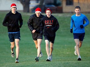 Windsor Legion junior cross-country team members Corey Bellemore, from left, Danny Piticariu, Brandon Allen and Ryan Sleiman work out at Malden Park in 2011. (NICK BRANCACCIO/The Windsor Star)