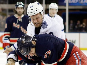 Toronto's Colton Orr, left, fights ex-Spit Mike Rupp during the first period in New York. (AP Photo/Frank Franklin II)