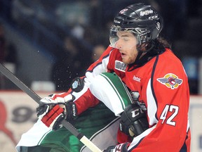 Windsor's Alex Aleardi right, is checked by Sudbury's Conor Cummins at the Sudbury Community Arena. (GINO DONATO/The Sudbury Star)