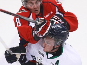 Windsor defenceman Trevor Murphy, top, collides with Plymouth's Stefan Noesen at the WFCU Centre. (TYLER BROWNBRIDGE/The Windsor Star)