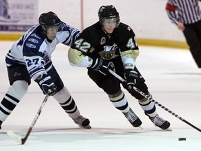 LaSalle's Scott Prier, right, is guarded by Dylan Bedard of St. Marys Wednesday at the Vollmer Centre. (TYLER BROWNBRIDGE/The Windsor Star)