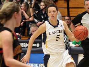 The University of Windsor's Bojana Kovacevic dribbles the ball against the Guelph Gryphons at the St. Denis Centre. (DYLAN KRISTY/The Windsor Star)