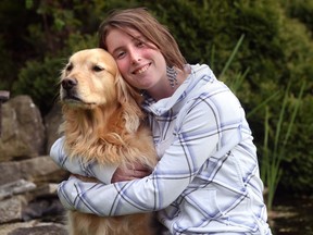File photo of Arielle Grondin with her dog at her Tecumseh home in May 2011. (DAN JANISSE/The Windsor Star)