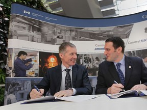 The University of Windsor has signed an agreement with Ottawa to collaborate with a Federal research laboratory to help develop lighter and more fuel efficient  materials  for automotive manufacturing. Jeff Watson (R), Conservative MP for Essex, was on hand Thursday, Jan. 10, 2013, for a formal signing of the agreement with University President Alan Wildeman.  (DAN JANISSE/The Windsor Star)