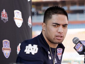 Notre Dame linebacker Manti Te'o answers a question during Media Day for the BCS National Championship college football game Saturday, Jan. 5, 2013, in Miami. Notre Dame faces Alabama in Monday's championship game. (AP Photo/David J. Phillip)
