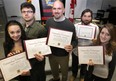 Windsor citizens show the citations for bravery that they received from the fire department on Jan. 4, 2013. From left: Tyler Hurst, 17; Josh Wells, 20; Chris Hutnik, 38; Enrico DeChellis, 36; Hayley Bachman, 19. (Dan Janisse / The Windsor Star)