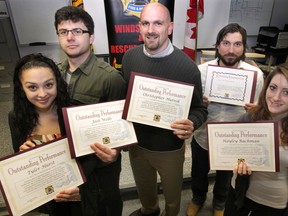 Windsor citizens show the citations for bravery that they received from the fire department on Jan. 4, 2013. From left: Tyler Hurst, 17; Josh Wells, 20; Chris Hutnik, 38; Enrico DeChellis, 36; Hayley Bachman, 19. (Dan Janisse / The Windsor Star)