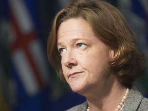 Premier Alison Redford answers questions from the media following a caucus meeting in this 2012 file photo. (Ted Rhodes/Calgary Herald)