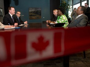 Foreign Affairs Minister John Baird meets with Philippe Zeller, France’s Ambassador to Canada (back right)Traoré Ami Diallo, Mali’s Ambassador to Canada, and N’Goran Kouamé, Ivory Coast's Ambassador to Canada (right) to discuss the situation in Mali Jan.16, 2013in Ottawa. (THE CANADIAN PRESS/Adrian Wyld)