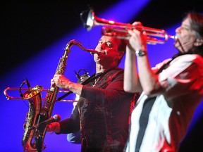 Chicago recording artists Walter Parazaider (L) on saxaphone glances toward Lee Loughnane playing trumpet during Chicago's concert in The Colosseum at Caesars Windsor Friday March 27, 2009. (Nick Brancaccio / The Windsor Star)