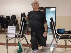Ken Ford, who suffers from COPD, exercises with the help of physiotherapist Donna Ofner.  Ofner helps people with lung disease become more physically active and manage their condition. (DAN JANISSE/The Windsor Star)