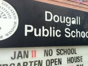 The sign at Dougall Public School reminds people of the lack of classes on Jan. 11, 2013. (Dalson Chen / The Windsor Star)