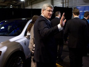 Canadian Prime Minister Stephen Harper makes his exit after speaking at Ford Motor plant in Oakville Ont. on Friday January 4, 2013. Harper announced the renewal of the automaotive Innovation Fund. THE CANADIAN PRESS/Chris Young