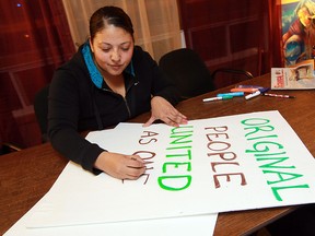 Victoria Rubio makes a sign in the OPIRG Resource Centre in Windsor on Tuesday, January 15, 2013. The signs are being made for the Idle No More protest that will take place near the Ambassador Bridge in Windsor on Wednesday.             (TYLER BROWNBRIDGE / The Windsor Star)