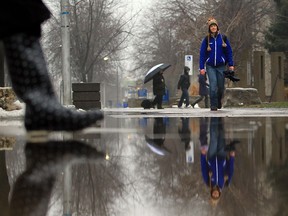 Pedestrians make their way through the rain at the University of Windsor on January 29, 2013 in Windsor, Ontario. (JASON KRYK/The Windsor Star)