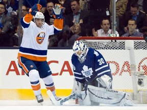 Maple Leafs goaltender Ben Scrivens, right, reacts as New York Islanders left winger Matt Moulson celebrates a goal in Toronto on Thursday January 24, 2013. (THE CANADIAN PRESS/Frank Gunn)