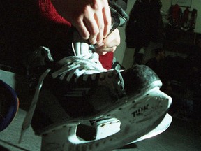 File photo of a young person tying up their hockey skates. (Windsor Star files)